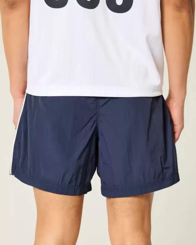 Baggy-Fußballshorts bis zur Mitte des Oberschenkels Baggy-Fußballshorts bis zur Mitte des Oberschenkels