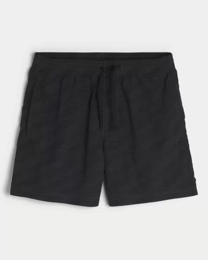 Baggy-Fußballshorts bis zur Mitte des Oberschenkels Baggy-Fußballshorts bis zur Mitte des Oberschenkels