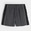 Baggy-Fußballshorts bis zur Mitte des Oberschenkels Baggy-Fußballshorts bis zur Mitte des Oberschenkels