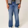 Baggy-Jeans mit dunkler Waschung und Rose-Grafik