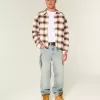 Baggy-Jeans mit Grafik in heller Waschung
