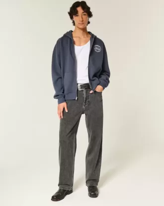Baggy-Jeans mit verwaschenem Logo und Grafik in Schwarz