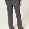 Baggy-Jeans mit verwaschenem Logo und Grafik in Schwarz