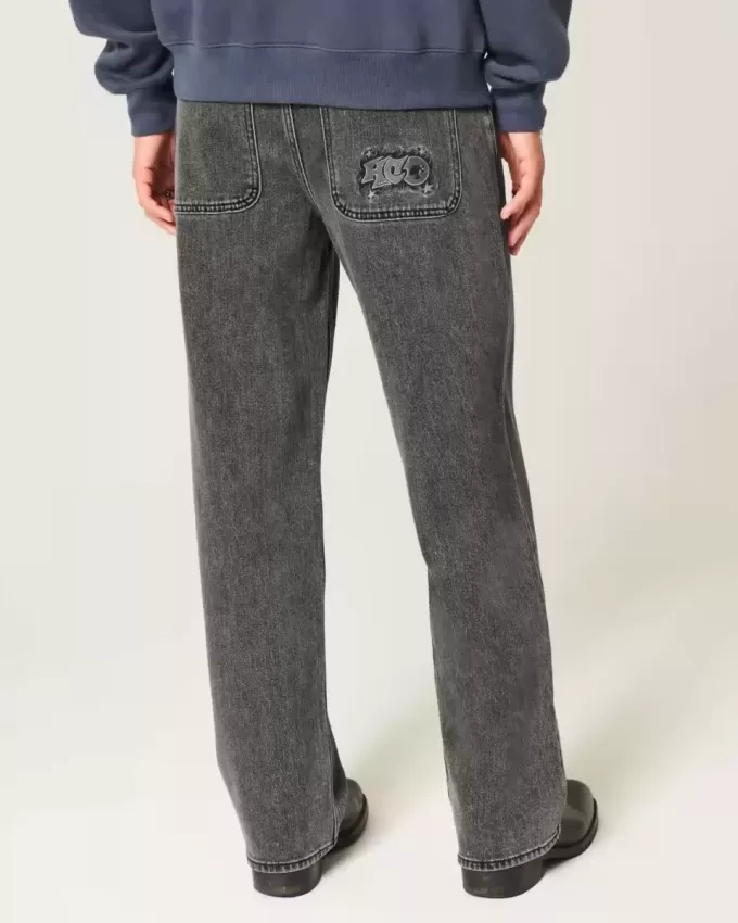 Baggy-Jeans mit verwaschenem Logo und Grafik in Schwarz