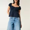 Baggy-Jeanshose mit niedriger Taille und mittlerer Waschung und Zahlengrafik