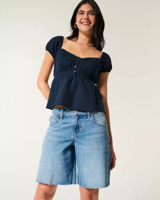 Baggy-Jeanshose mit niedriger Taille und mittlerer Waschung und Zahlengrafik