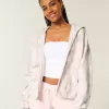 Übergroßer rosa Camouflage-Kapuzenpullover mit Reißverschluss Übergroßer rosa Camouflage-Kapuzenpullover mit Reißverschluss