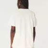 Übergroßes T-Shirt mit Grafik des Saint Thomas Racquet Club Übergroßes T-Shirt mit Grafik des Saint Thomas Racquet Club