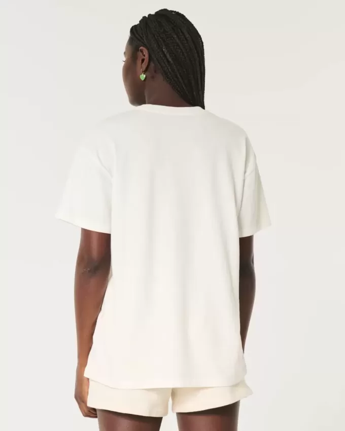 Übergroßes T-Shirt mit Grafik des Saint Thomas Racquet Club Übergroßes T-Shirt mit Grafik des Saint Thomas Racquet Club