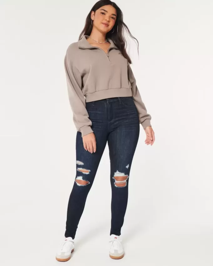 Curvy High-Rise-Jeansleggings in dunkler Waschung mit Rissen Curvy High-Rise-Jeansleggings in dunkler Waschung mit Rissen
