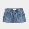 Curvy Low-Rise Mini-Jeansrock mit bestickter Schleife Curvy Low-Rise Mini-Jeansrock mit bestickter Schleife