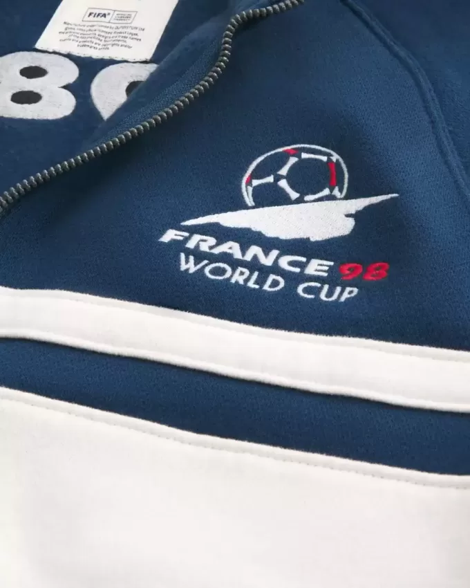 Fleece-Trainingsjacke mit Grafik zur FIFA-Weltmeisterschaft Frankreich 1998 Fleece-Trainingsjacke mit Grafik zur FIFA-Weltmeisterschaft Frankreich 1998