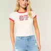 High-Rise Ripped Denim Shortie Shorts in mittlerer heller Waschung High-Rise Ripped Denim Shortie Shorts in mittlerer heller Waschung