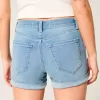 High-Rise Ripped Denim Shortie Shorts in mittlerer heller Waschung High-Rise Ripped Denim Shortie Shorts in mittlerer heller Waschung
