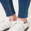 High-Rise-Risse, zerrissene Super Skinny Jeans in mittlerer Waschung High-Rise-Risse, zerrissene Super Skinny Jeans in mittlerer Waschung