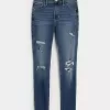 High-Rise-Risse, zerrissene Super Skinny Jeans in mittlerer Waschung High-Rise-Risse, zerrissene Super Skinny Jeans in mittlerer Waschung