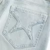 Hoch geschnittene Schlagjeans mit heller Waschung und Sterntaschen Hoch geschnittene Schlagjeans mit heller Waschung und Sterntaschen