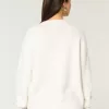 Hollister – Comfy Cloud – Rundhalspullover mit amerikanischer Flaggengrafik Hollister – Comfy Cloud – Rundhalspullover mit amerikanischer Flaggengrafik