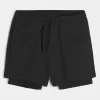Hybrid-Aktivshorts bis zur Mitte des Oberschenkels Hybrid-Aktivshorts bis zur Mitte des Oberschenkels