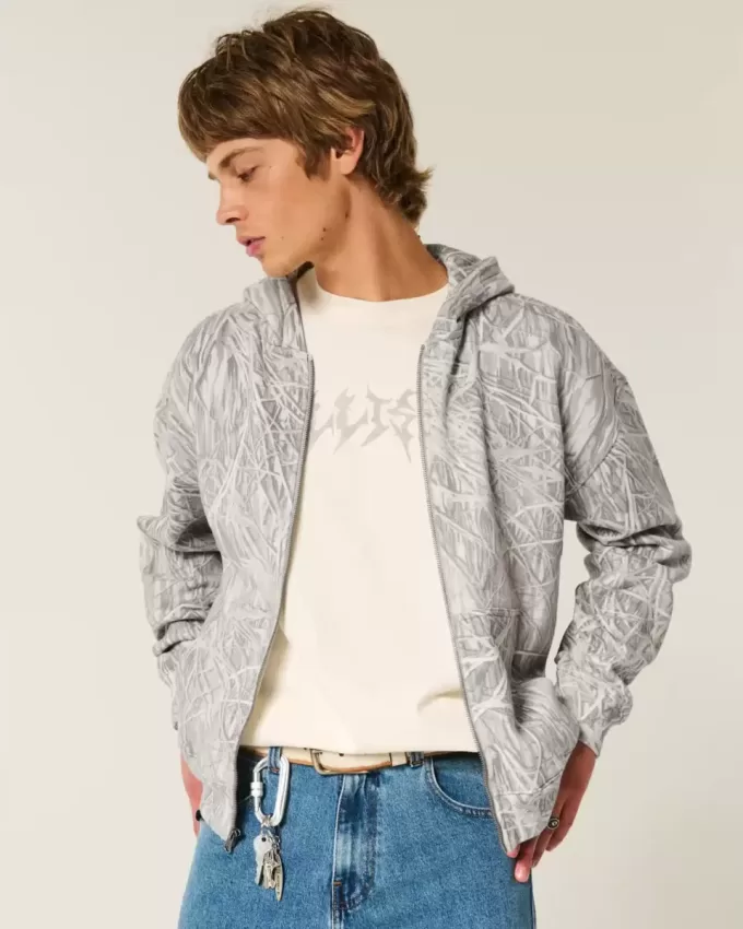 Kastenförmiger Kapuzenpullover mit Camouflage-Muster und Reißverschluss Kastenförmiger Kapuzenpullover mit Camouflage-Muster und Reißverschluss