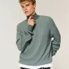 Kastenförmiger Pullover mit Viertelreißverschluss Kastenförmiger Pullover mit Viertelreißverschluss