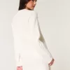 Kuscheliges Pulloverkleid mit Zopfmuster Kuscheliges Pulloverkleid mit Zopfmuster