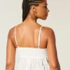 Leicht besticktes Babydoll-Oberteil mit Glanz Leicht besticktes Babydoll-Oberteil mit Glanz