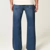 Lockere Bootcut-Jeans in dunkler Waschung Lockere Bootcut-Jeans in dunkler Waschung