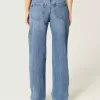 Lockere Jeans mit niedrigem Bund und Rissen in mittlerer Waschung Lockere Jeans mit niedrigem Bund und Rissen in mittlerer Waschung