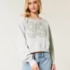 Lockeres, schulterfreies Sweatshirt mit Rundhalsausschnitt und Zahlengrafik Lockeres, schulterfreies Sweatshirt mit Rundhalsausschnitt und Zahlengrafik