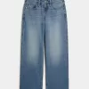 Low-Rise Baggy-Jeans mit mittlerer Waschung und Nietenherzen Low-Rise Baggy-Jeans mit mittlerer Waschung und Nietenherzen