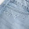 Low-Rise-Mini-Jeansrock der Klasse 26