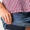 Low-Rise-Mini-Skort aus Denim mit Nieten Low-Rise-Mini-Skort aus Denim mit Nieten