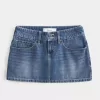 Low-Rise-Mini-Skort aus Denim mit Nieten Low-Rise-Mini-Skort aus Denim mit Nieten