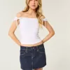 Low-Rise-Mini-Skort aus dunkel gewaschenem, kariertem Denim mit Tasche Low-Rise-Mini-Skort aus dunkel gewaschenem, kariertem Denim mit Tasche