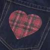 Low-Rise-Mini-Skort aus dunkel gewaschenem, kariertem Denim mit Tasche Low-Rise-Mini-Skort aus dunkel gewaschenem, kariertem Denim mit Tasche