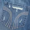 Low-Rise-Mini-Skort aus zerrissenem, dunkel gewaschenem Denim Low-Rise-Mini-Skort aus zerrissenem, dunkel gewaschenem Denim