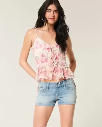 Low-Rise-Shortie-Shorts aus Denim mit mittlerer Waschung und Nieten