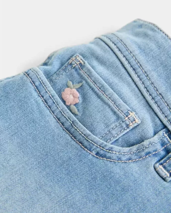 Low-Rise-Shortie-Shorts aus hell gewaschenem Denim mit Blumenstickerei Low-Rise-Shortie-Shorts aus hell gewaschenem Denim mit Blumenstickerei