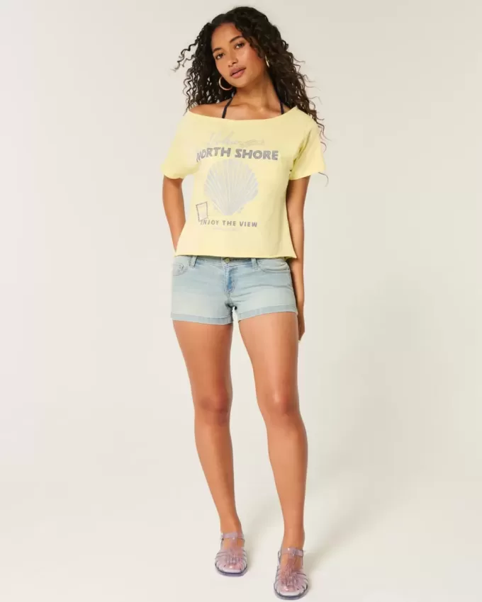 Low-Rise-Shorts aus hell gewaschenem Denim mit Blumenmuster und Tasche Low-Rise-Shorts aus hell gewaschenem Denim mit Blumenmuster und Tasche
