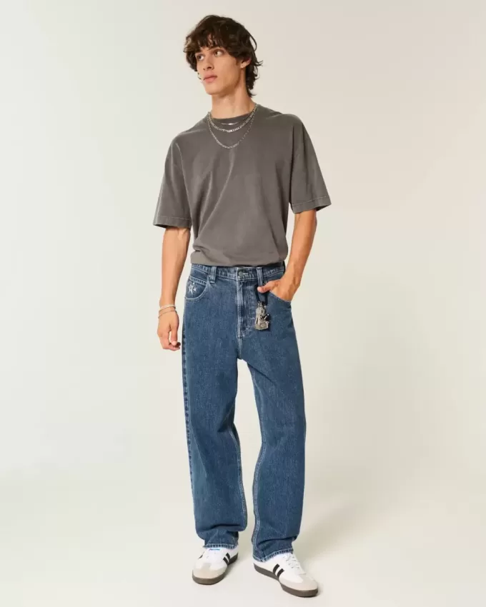 Mittelwaschbare Skater-Baggy-Jeans mit Sterngrafik Mittelwaschbare Skater-Baggy-Jeans mit Sterngrafik