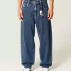 Mittelwaschbare Skater-Baggy-Jeans mit Sterngrafik Mittelwaschbare Skater-Baggy-Jeans mit Sterngrafik