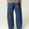 Mittelwaschbare Skater-Baggy-Jeans mit Sterngrafik Mittelwaschbare Skater-Baggy-Jeans mit Sterngrafik