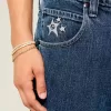 Mittelwaschbare Skater-Baggy-Jeans mit Sterngrafik Mittelwaschbare Skater-Baggy-Jeans mit Sterngrafik