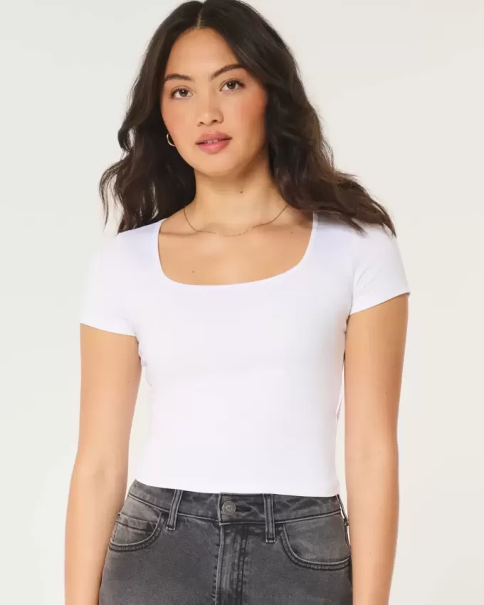 Nahtloses Baby-T-Shirt aus Stoff mit quadratischem Ausschnitt Nahtloses Baby-T-Shirt aus Stoff mit quadratischem Ausschnitt