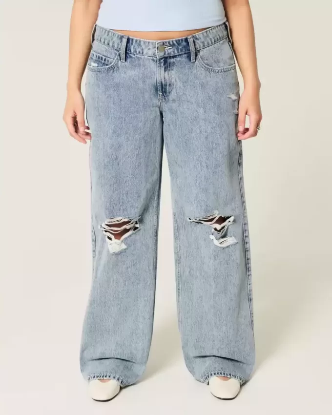 Niedrig geschnittene Baggy-Jeans mit Rissen in mittlerer Waschung Niedrig geschnittene Baggy-Jeans mit Rissen in mittlerer Waschung