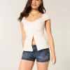 Niedrig geschnittene, dunkel gewaschene, bestickte Denim-Shorts Niedrig geschnittene, dunkel gewaschene, bestickte Denim-Shorts
