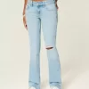 Niedrig geschnittene, zerrissene Bootcut-Jeans in heller Waschung mit Stickerei Niedrig geschnittene, zerrissene Bootcut-Jeans in heller Waschung mit Stickerei