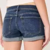 Niedrig geschnittene, zerrissene Shortie-Shorts aus dunkel gewaschenem Denim Niedrig geschnittene, zerrissene Shortie-Shorts aus dunkel gewaschenem Denim