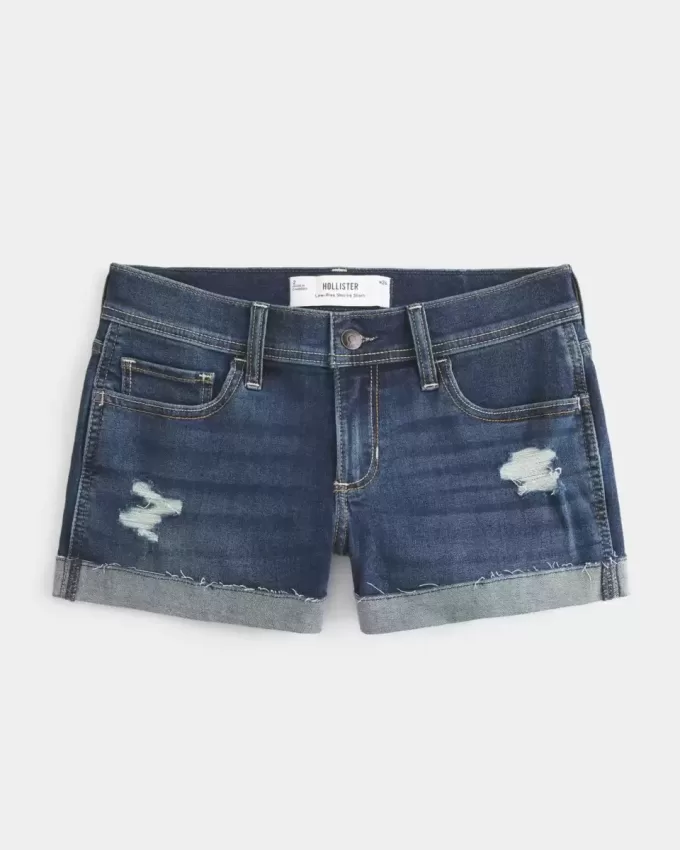 Niedrig geschnittene, zerrissene Shortie-Shorts aus dunkel gewaschenem Denim Niedrig geschnittene, zerrissene Shortie-Shorts aus dunkel gewaschenem Denim